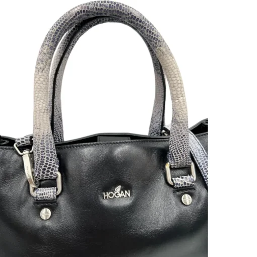 Satchel Hogan con tracolla